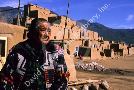 Indian pueblo man and adobe buildings in Taos, New Mexico.