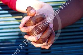 Interracial friends holding hands.  Close up of black white, male female hands.