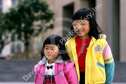 Chinese sisters in Hong Kong.