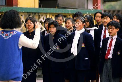 Chinese students in uniforms at a Buddhist Monestary school in Hong Kong.
