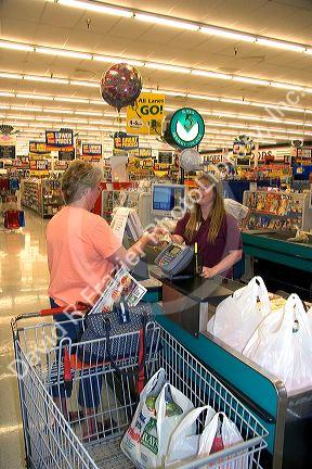 Customer and cashier at Ray's Market Place in Lima, Ohio.