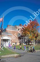 Children walking in a line into their elementary school.  Jeffersonville, Vermont.