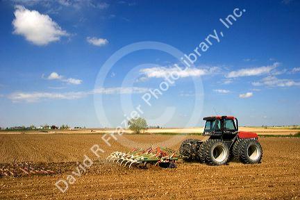 A tractor spring tilling a crop in Canyon County, Idaho.