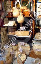 Many flavors and types of cheese on display at store in Turin, Italy.