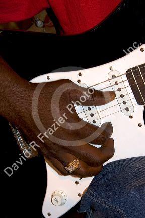 A musician playing an electric guitar on Beale Street in Memphis, Tennessee.
