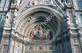 Painting and sculptures adorn the exterior facade of the Duomo in Florence, Italy.