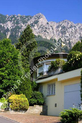 A house in Lichtenstein with the Swiss Alps in the background.