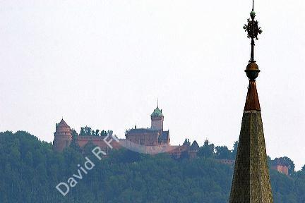 Church steeple near the village of Ribeauville, Eastern France with Koenigsbourg Castle in the background.