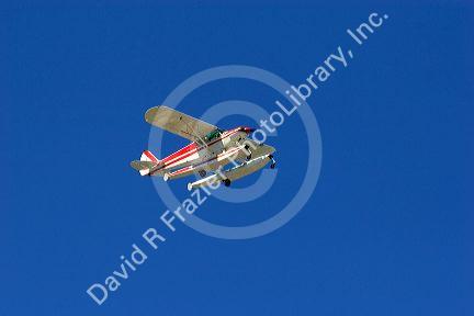 Piper Super Cub float plane in flight.