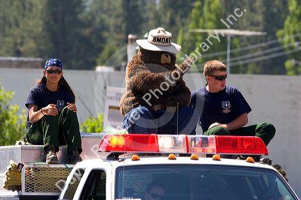 Smokey the Bear and young Forest Service workers in a small town Fourth of July parade in Cascade, Idaho.