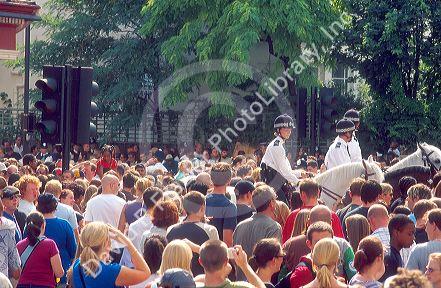 Police on horseback working the crowd at Notting Hill festival in London, England.