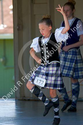 Young girl competes in a Scottish dance contest at Highland Festival on Prince Edward Island, Canada.