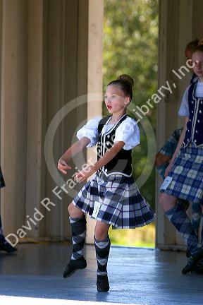 Young girl competes in a Scottish dance contest at Highland Festival on Prince Edward Island, Canada.