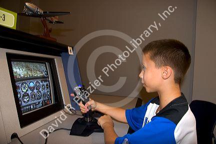 A child using a flight training computer at the McDonnell Planetarium in St. Louis, Missouri.
