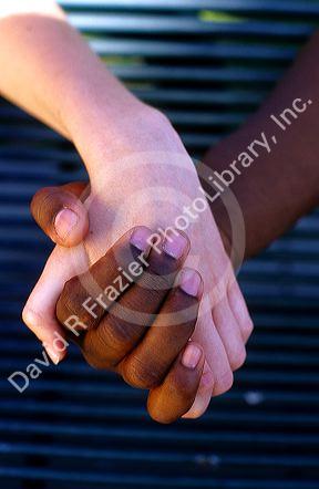 Interracial couple holding hands. MR