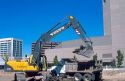Power shovel loading material into dump truck at Boise, Idaho construction site.