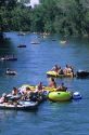 People float down the Boise River on inner tubes and rafts in Boise, Idaho.