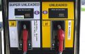 Unleaded gas pump with ethanol sign.