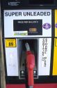 Unleaded gas pump with ethanol sign.