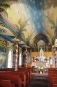 The interior of St. Benedicts painted church on Big Island Hawaii.