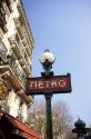 A Paris Metro sign and lamp post, France.