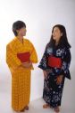 Japanese women wearing kimonos, native dress.  MR