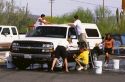 High School teens washing cars as fund raiser for the band at Ajo, Arizona.