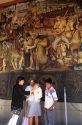 Visitors  view the Diego Rivera mural at the National Palace in Mexico City, Mexico.