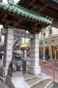 Stone figure of a dragon sits at the entrance to Chinatown, San Francisco, California.