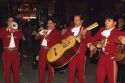 A mariachi band playing on the street in Mexico City, Mexico.
