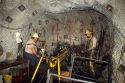 Miners drilling holes for dynomite with a pneumatic drill in the Lucky Friday Silver Mine at Wallace, Idaho.