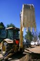 Backhoe bucket with teeth on a construction site in Boise, Idaho.