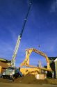 Truck mounted crane delivering trusses in Boise, Idaho.