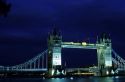 The Tower Bridge across the River Thames at night in London, England.