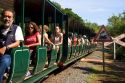 Passengers ride on the Green Train of The Jungle at Iguazu, Argentina.