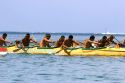 Tahitians take part in an outrigger canoe pirogue race off the island of Moorea.
