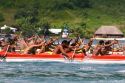 Tahitians take part in an outrigger canoe pirogue race off the island of Moorea.