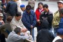 Asian people play a game of cards in Chinatown, San Francisco, California.