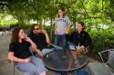 A group of people smoking outdoors at a coffee shop in Boise, Idaho.  MR.