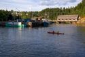 People sea kayaking at high tide in the Bay of Fundy at St. Martins, New Brunswick, Canada.