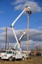 Electric power lineman installing new lines in Boise, Idaho.