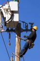 Electric power lineman installing new lines in Boise, Idaho.