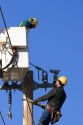 Electric power lineman installing new lines in Boise, Idaho.