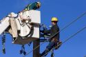 Electric power lineman installing new lines in Boise, Idaho.