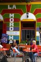 People dine outdoors at a restaurant in the La Boca area of Buenos Aires, Argentina.