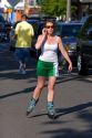 Woman talking on a cell phone while rollerblading in Seattle, Washington.