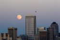 Full moon over the city of Seattle, Washington and the Two Union Square Building.