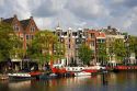 Row houses along the Amstel River in Amsterdam, Netherlands.