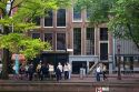 People stand in front of the Anne Frank House in Amsterdam, Netherlands.