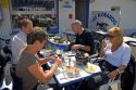 Tourists eating seafood at a sidewalk restaurant in the village of Audresselles in the department of Pas-de Calais, France.